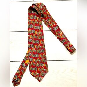 SALVATORE FERRAGAMO Silk Tie. Flag & Shield Motif in Red w/Orange‎ Blue & Brown.